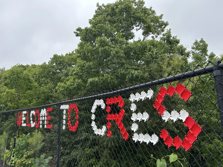 welcome to CRES message in chain link fence