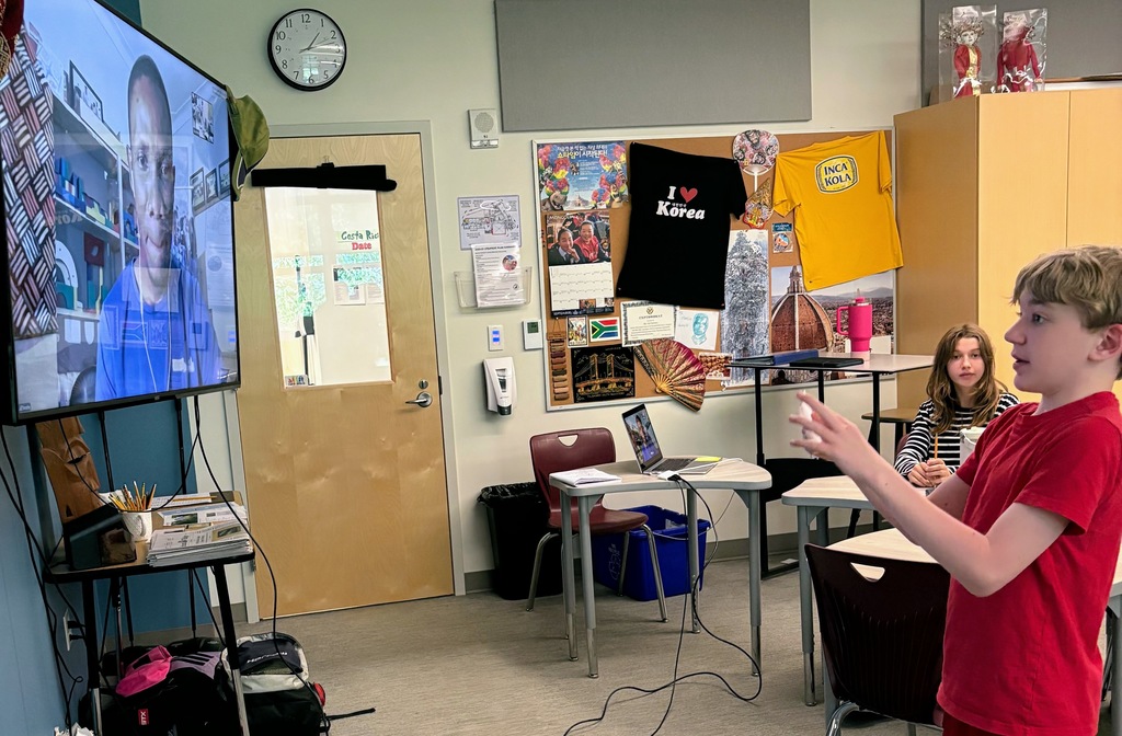 student videoconferencing with non-profit leader in Uganda