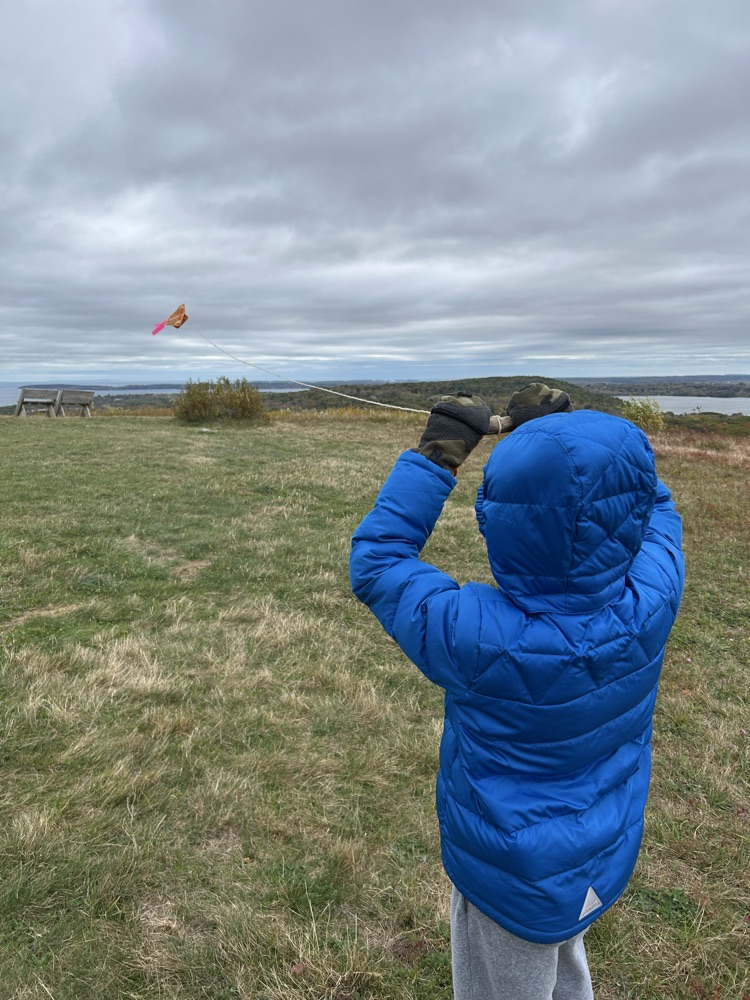 student flying a kite