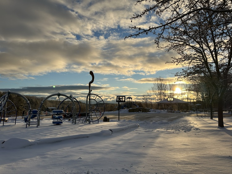 snowy playground at sunrise 