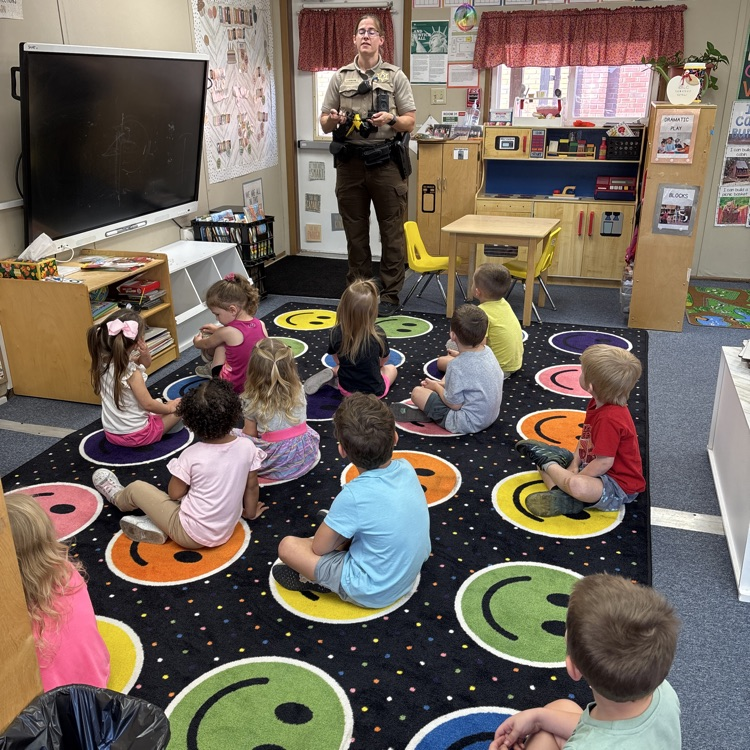 Officer G came to visit today and tells us how police officers helps all out