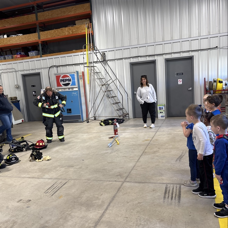Fireman Ryan putting on the fire gear