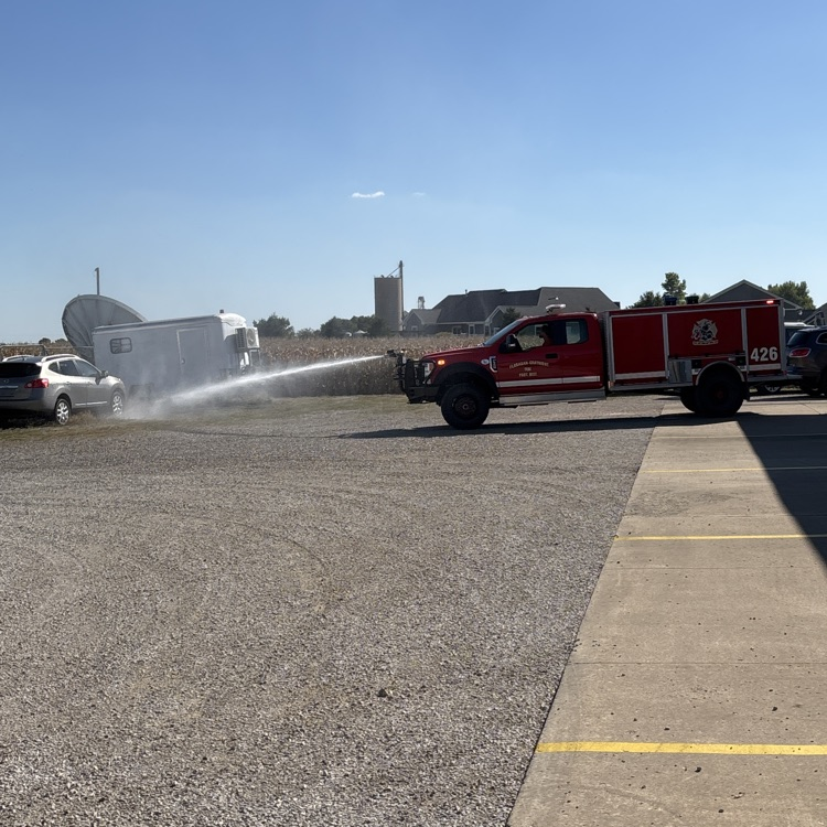 We are checking out the new brush truck! We didn’t get wet at least