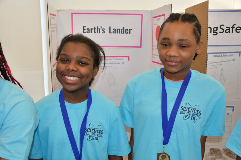 Brownell STEM Academy scholars show off their STEM projects and awards from the Elementary Flint Regional Science and Engineering Fair