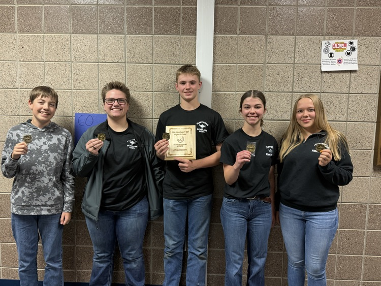 Varsity Scholars Bowl team with champion medals  