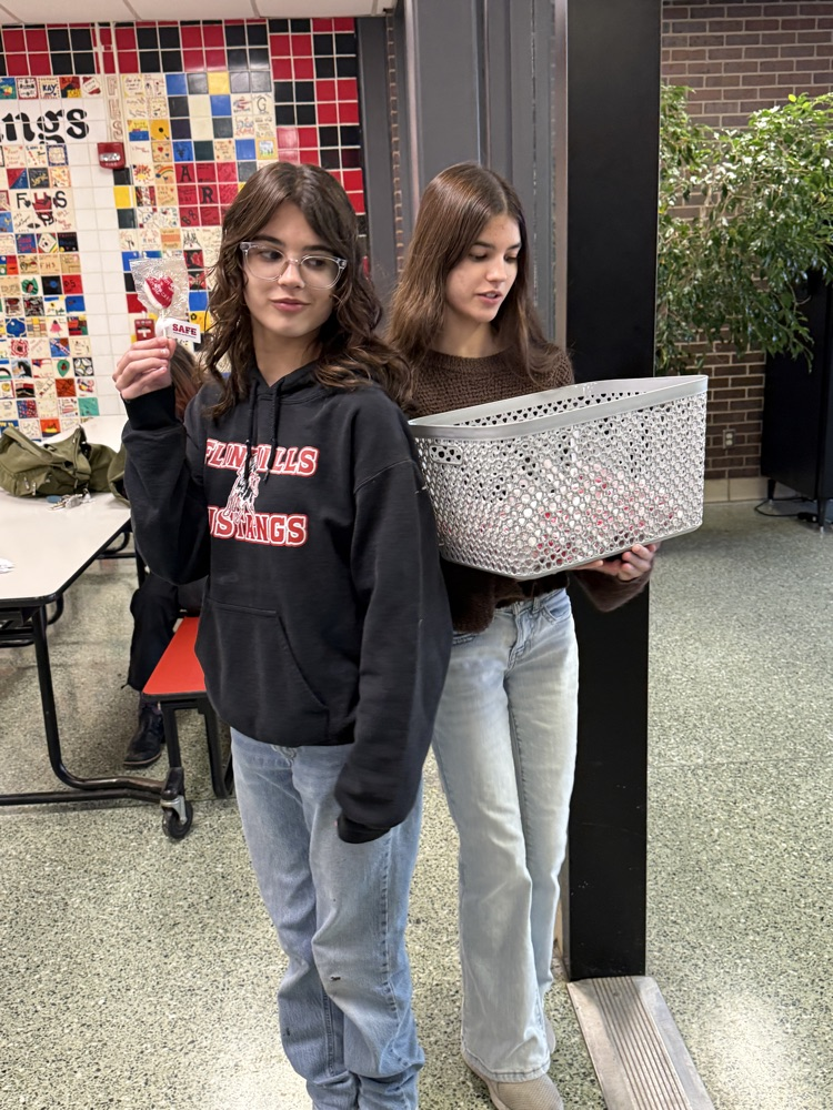 Passing out suckers at the door to all middle & high school students