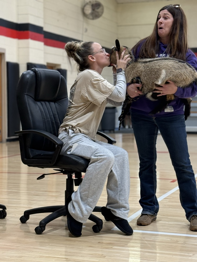 Mrs Thomas kissing Dory the goat  