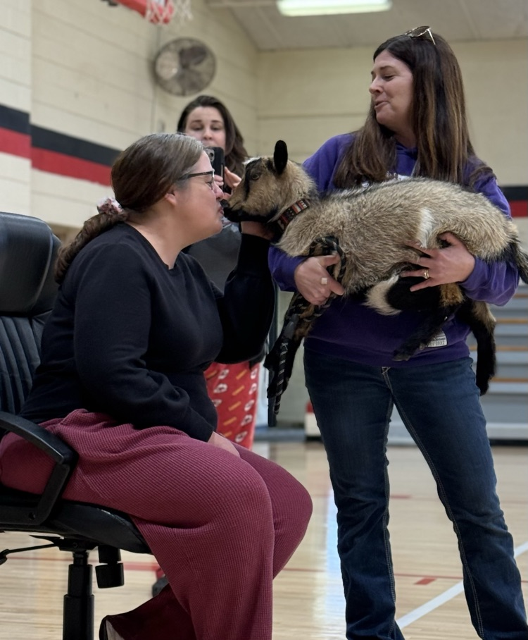 Mrs Cogdell kissing Dory the goat  