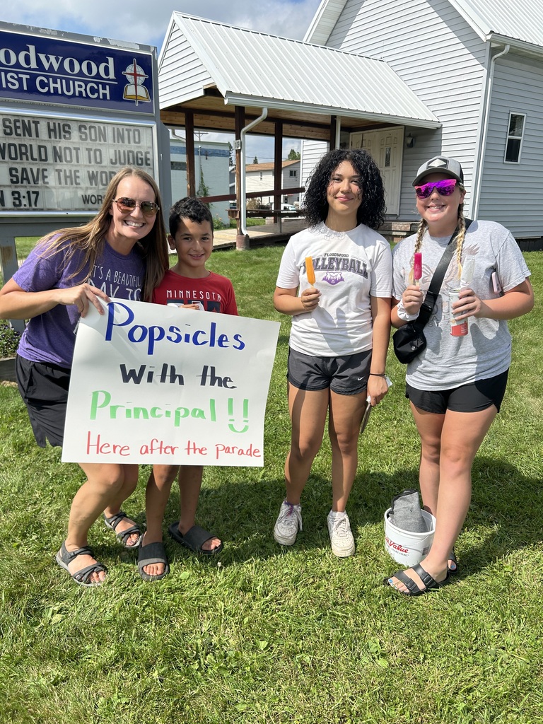 Principal Fjeld with students handing out popsicles