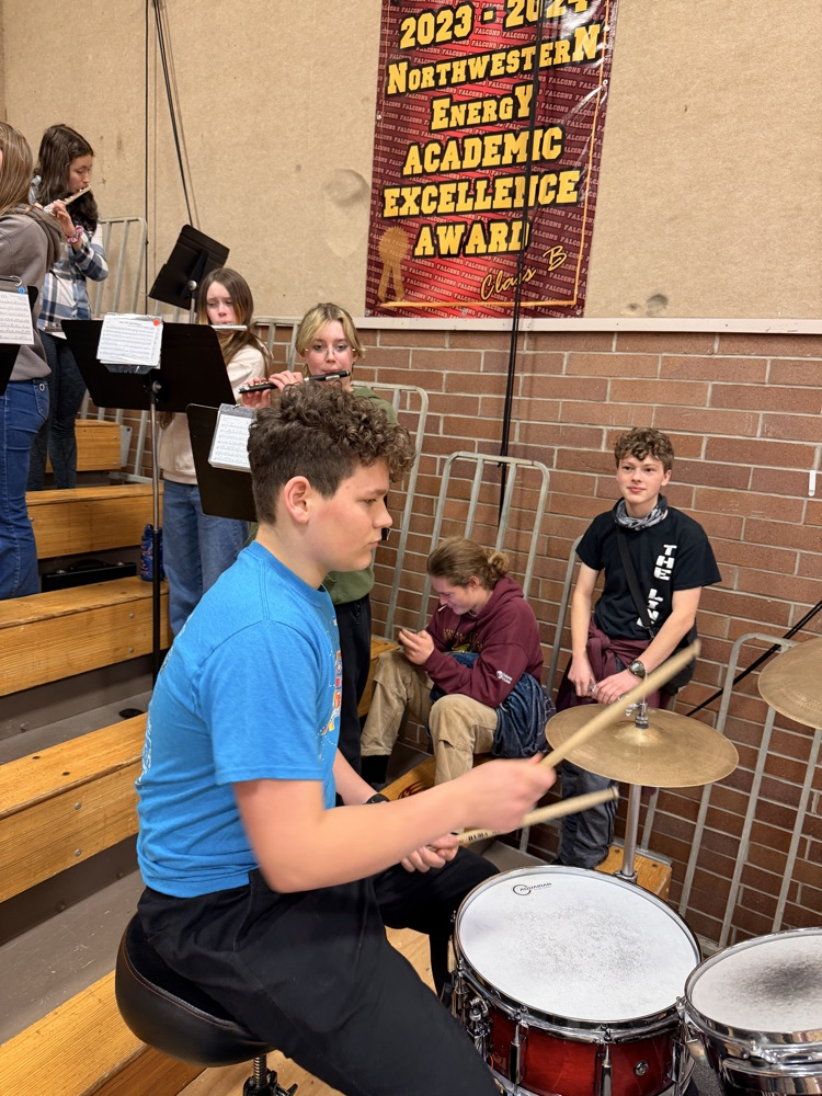 Garrett Degel playing the school song.