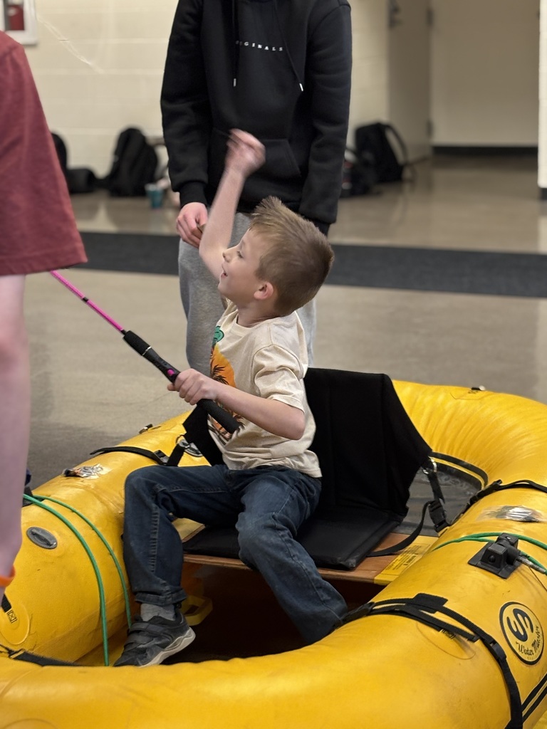 boy fishing in raft