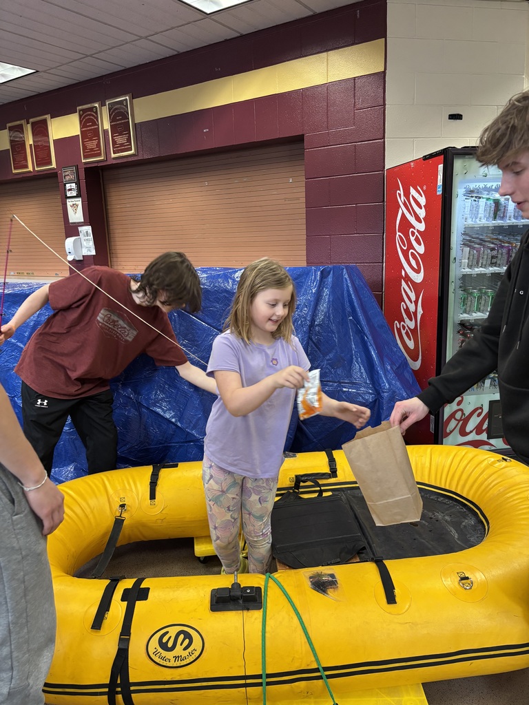 girl in raft pretending to fish