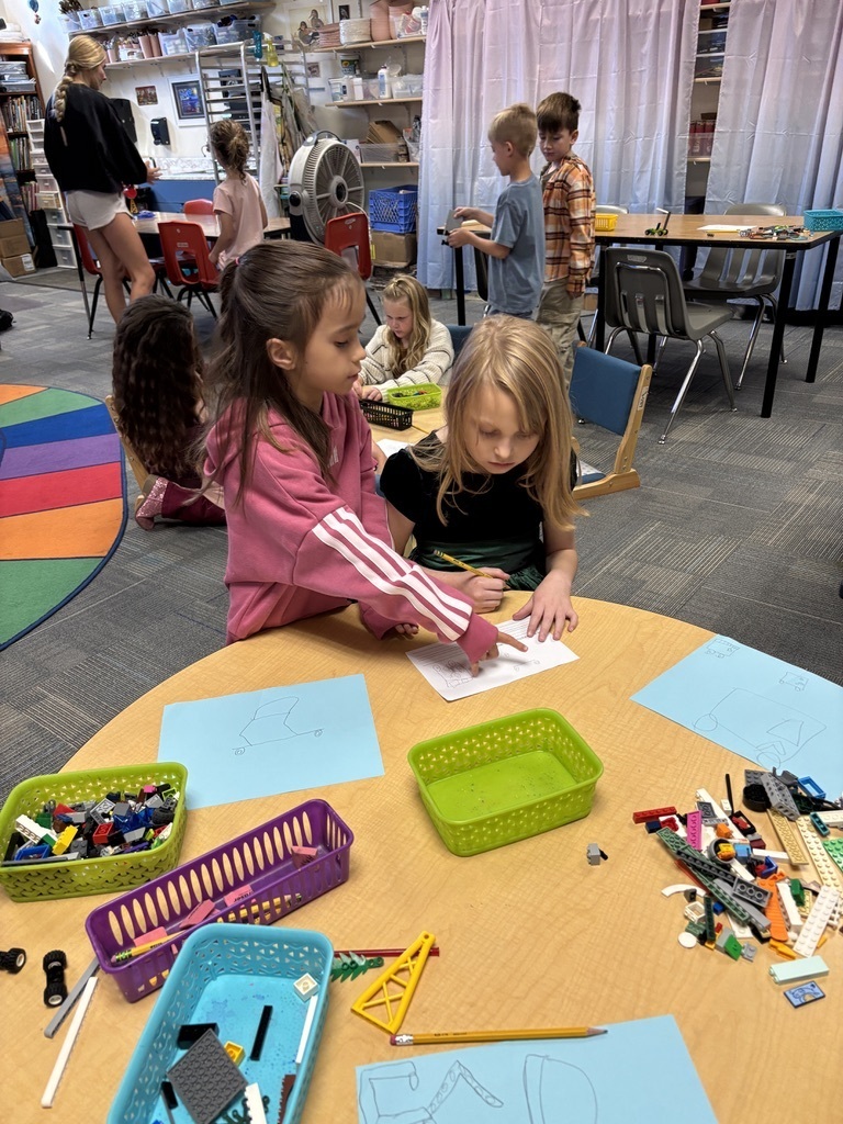 second graders working at a table