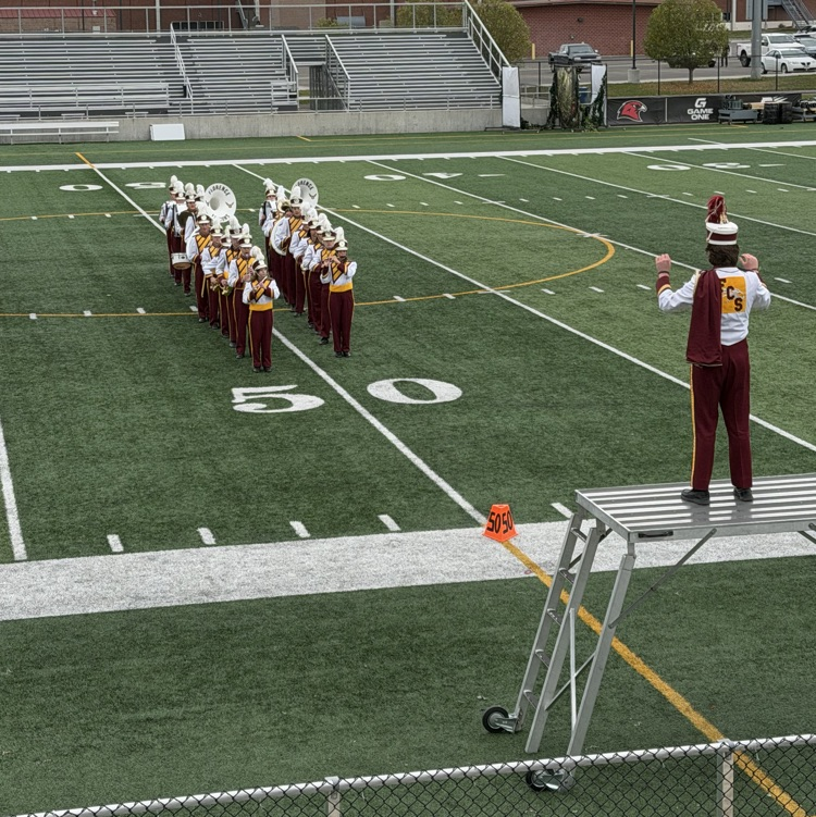 Drum Major Asher Simmerman conducting the band