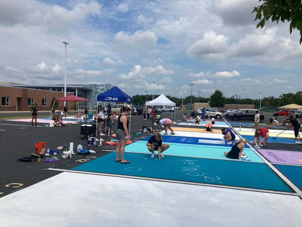 Seniors painting parking spots