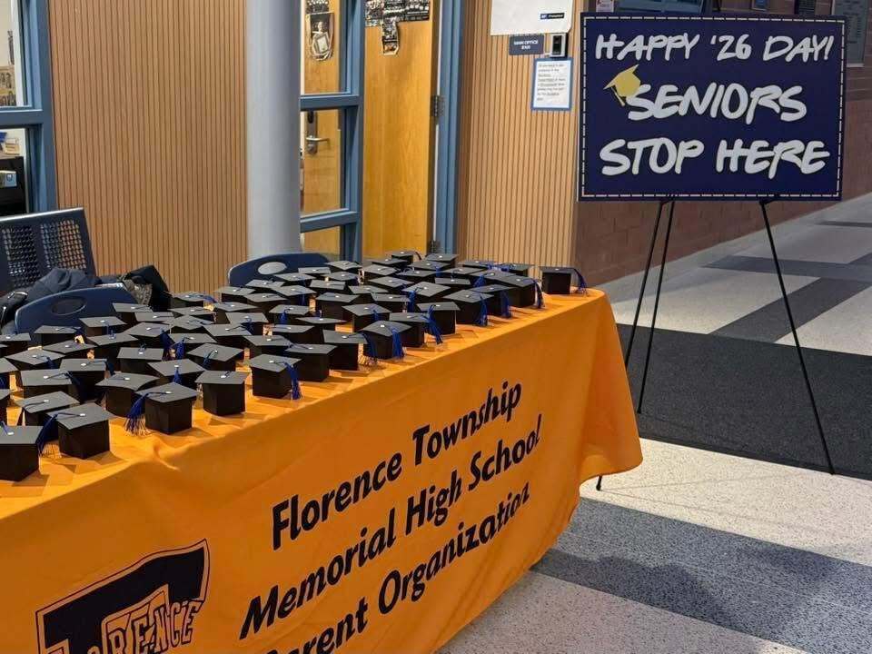 hs table with grad caps on it anouncing happy 2026 senior day
