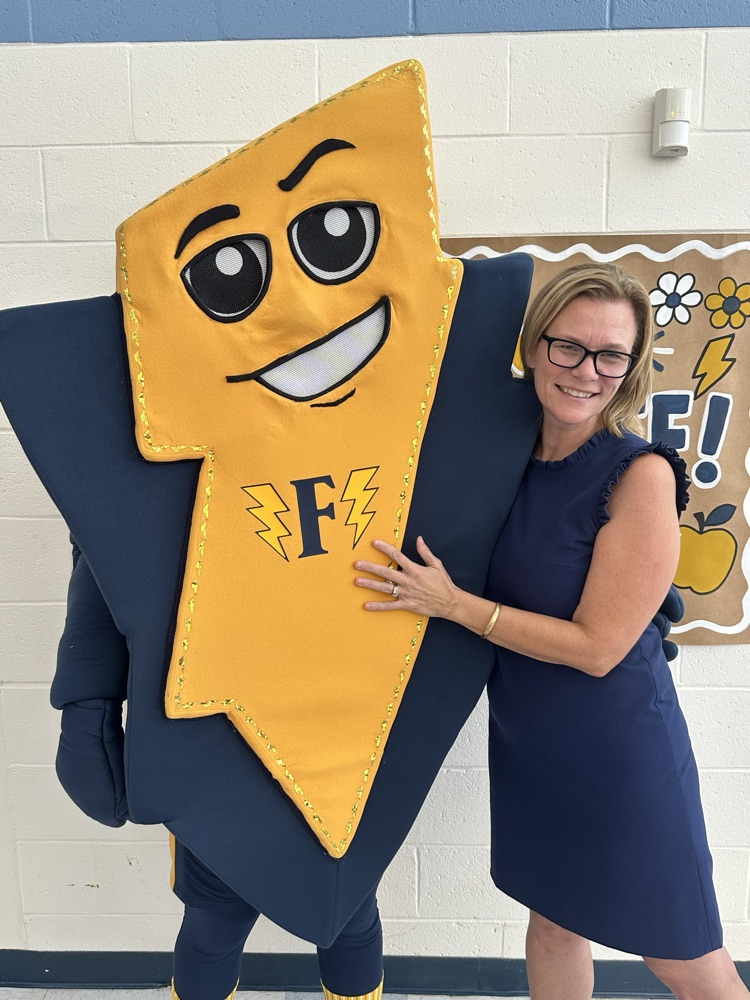Picture of superintendent with Fred the flash