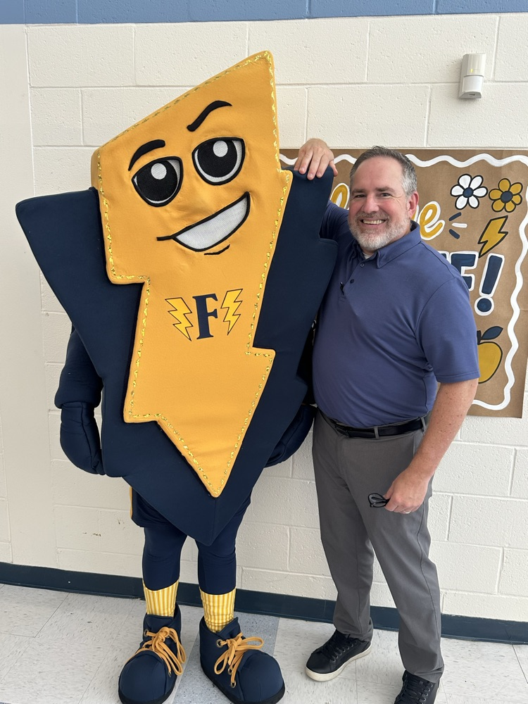Picture of director of special services with Fred the flash