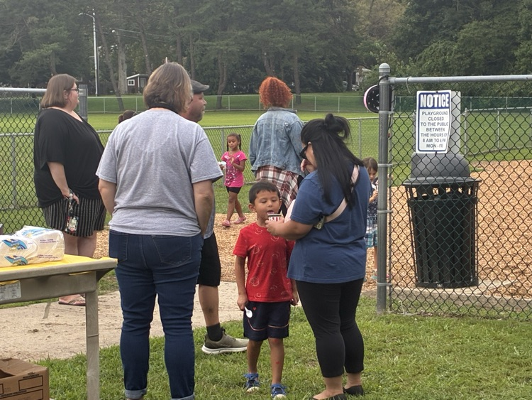 The principal talking to families  