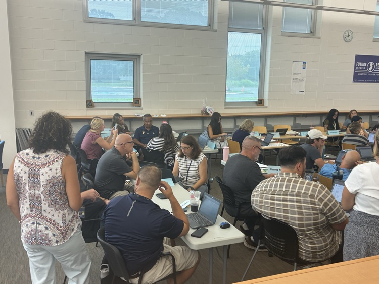 Picture of high school staff in a meeting