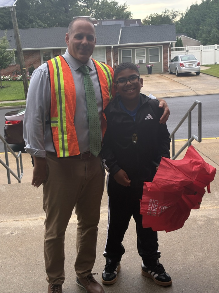 Principal hugging student 