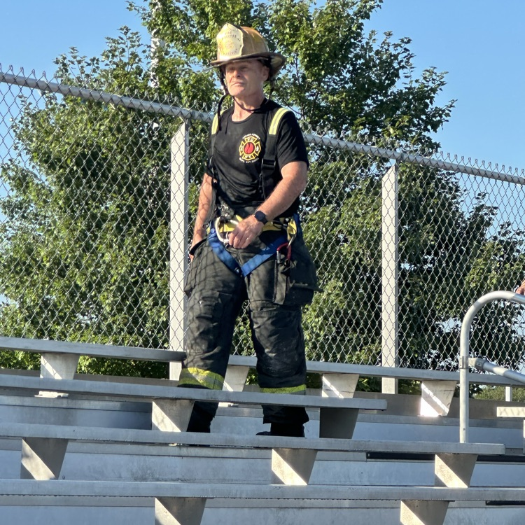 fireman, climbing bleachers