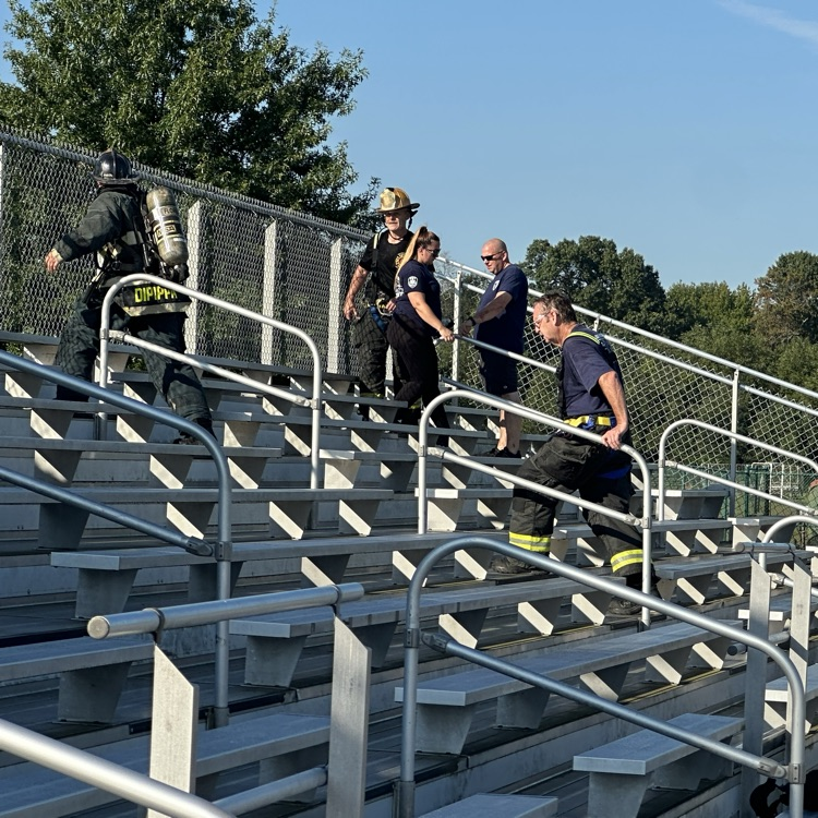 Fireman, climbing bleachers