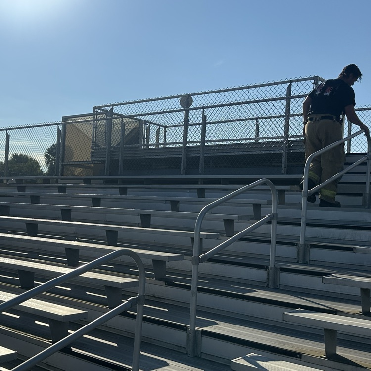 firemen climbing bleachers 