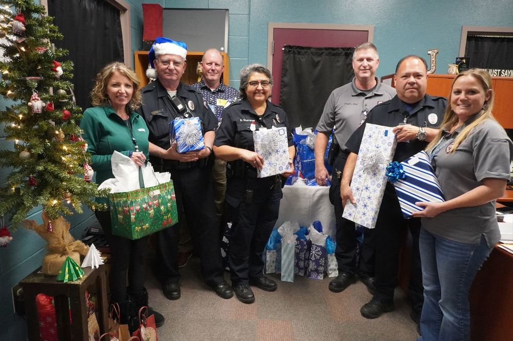 district police officers holding presents