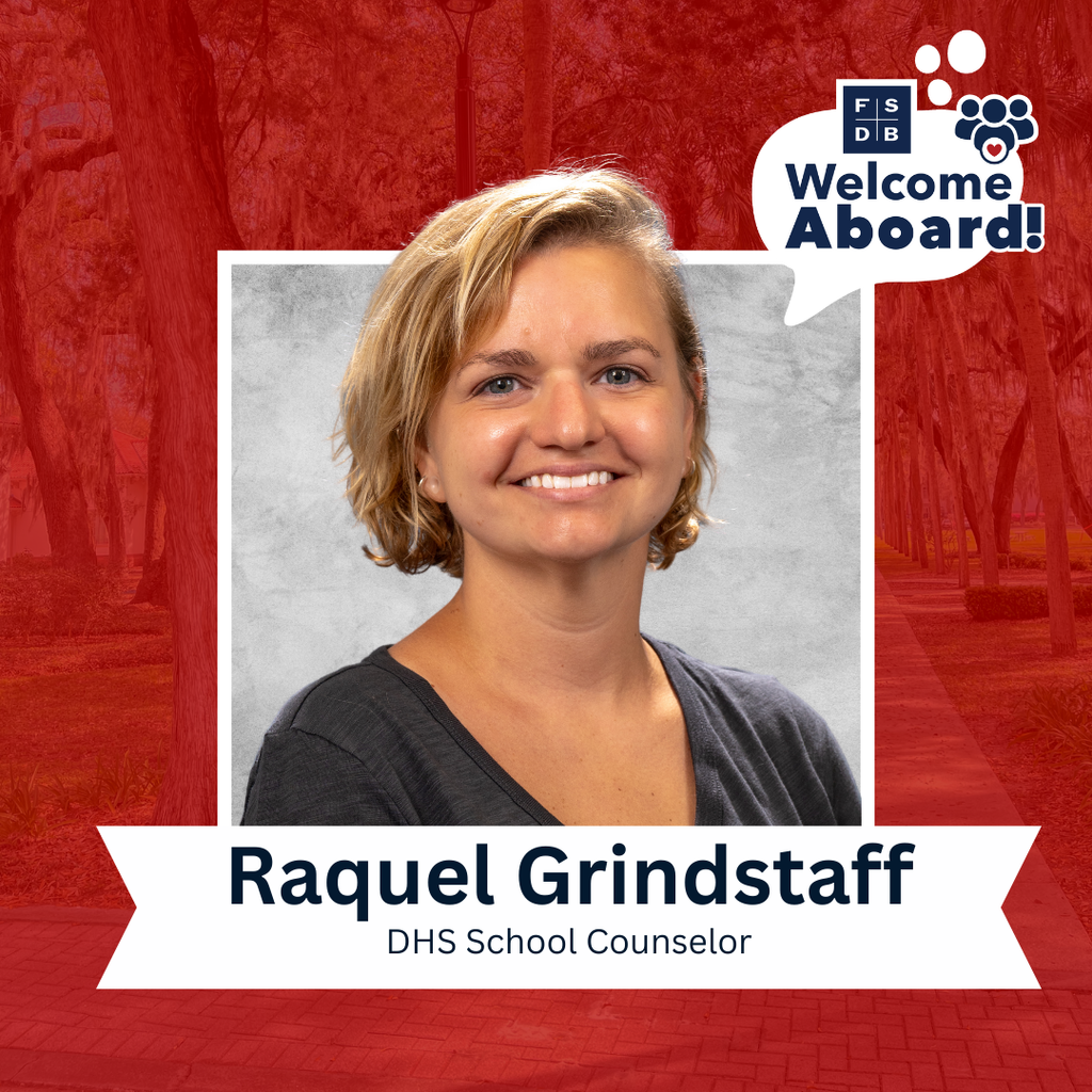 Raquel is wearing a black v-neck shirt smiling with a silver backdrop and red background behind her. Below the photo says "Raquel Grindstaff, DHS School Counselor"