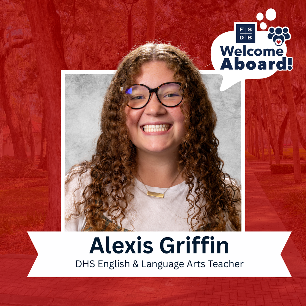 Alexis is wearing a white shirt with plaid dress smiling with a silver backdrop and red background. Below the photo says "Alexis Griffin, DHS English and Language Arts Teacher"