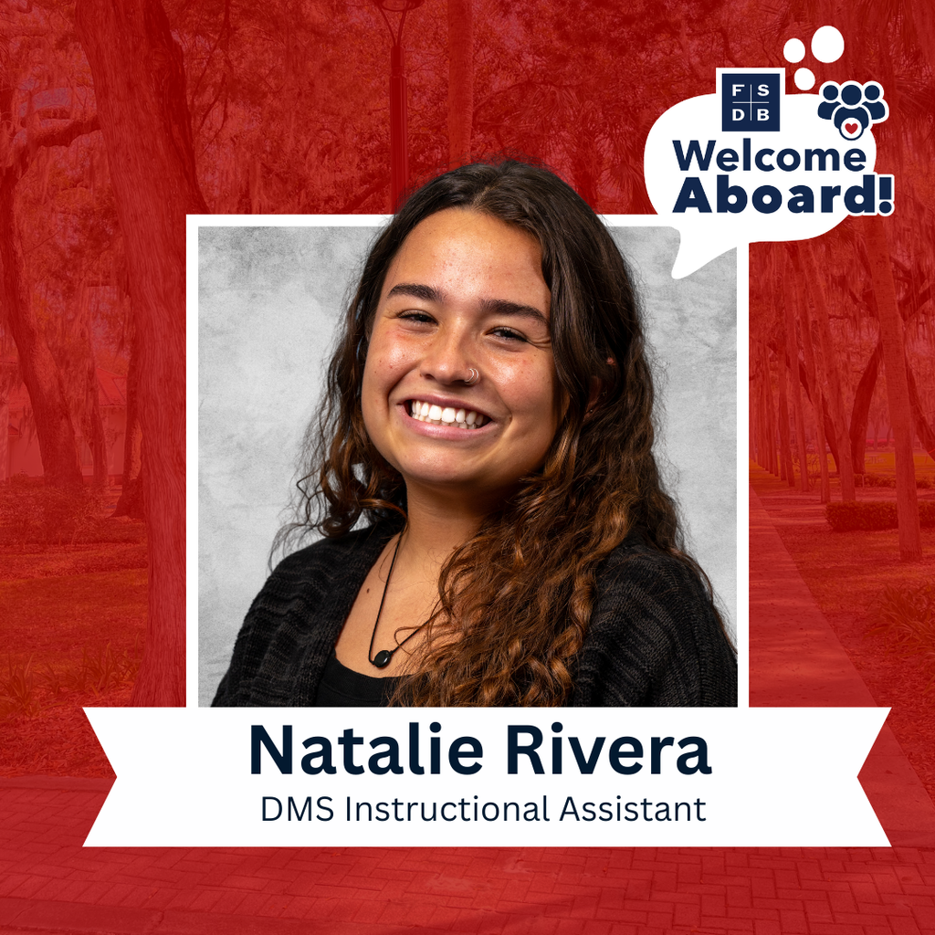 Natalie is wearing a black shirt smiling for her photo with a silver backdrop and red background. Below the photo says "Natalie Rivera, DMS Instructional Assistant"
