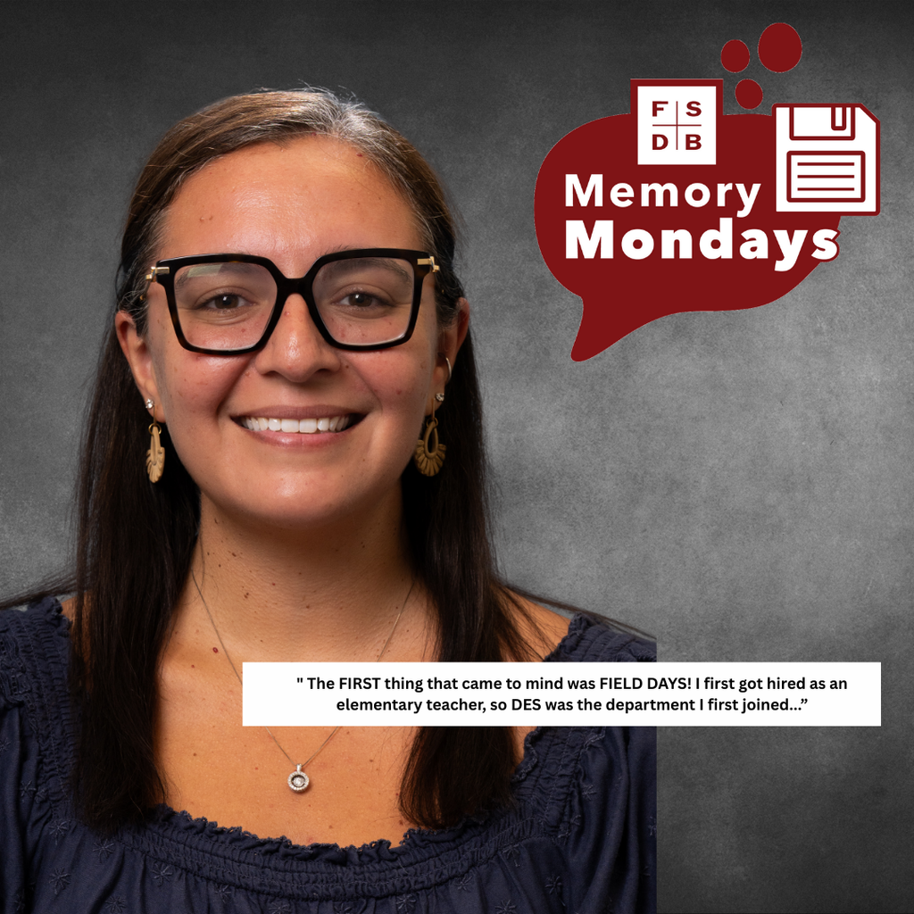 Alessandra is wearing a navy dress smiling for her photo with a white text box that says "The first thing that came to mind was field days. I first got hired as an elementary teacher, so DES was the department I first joined..."