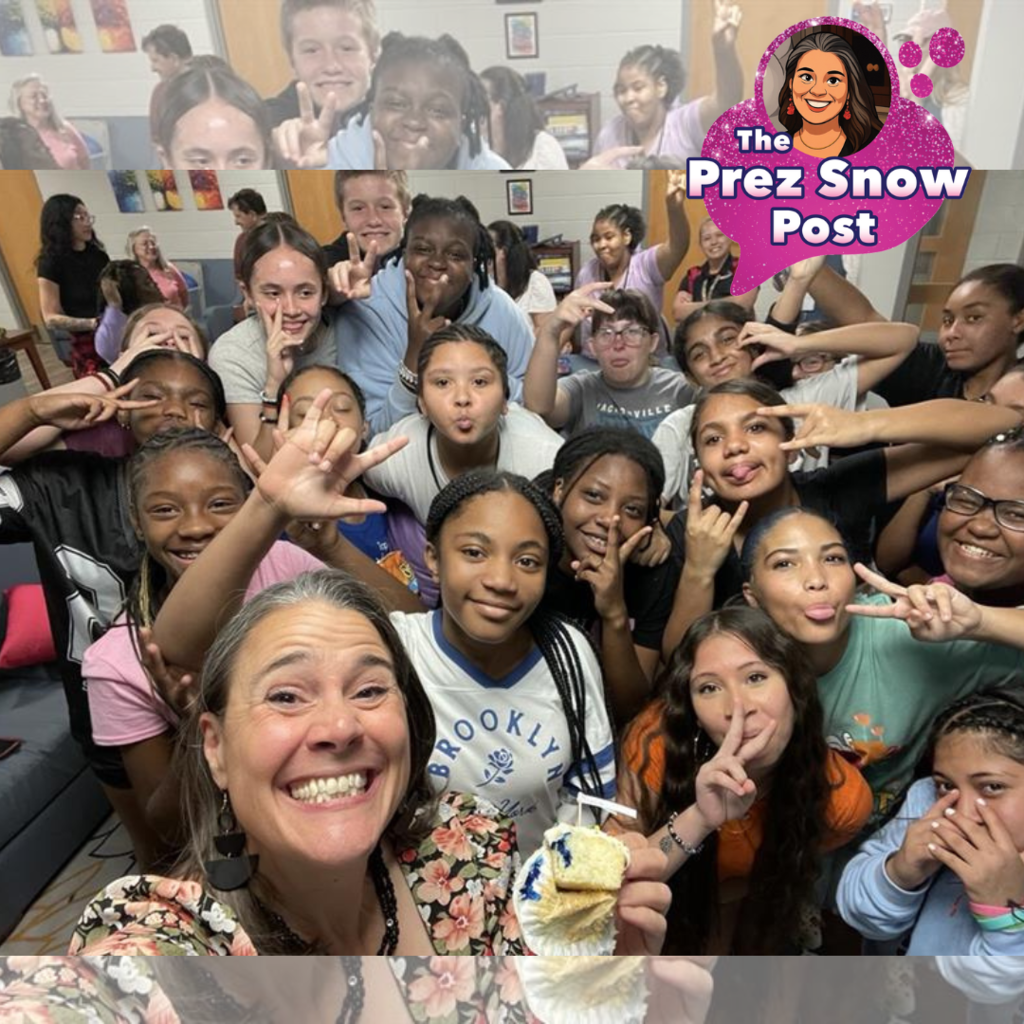 President Tracie Snow is taking a selfie with the DMS dorm students in the dorms.