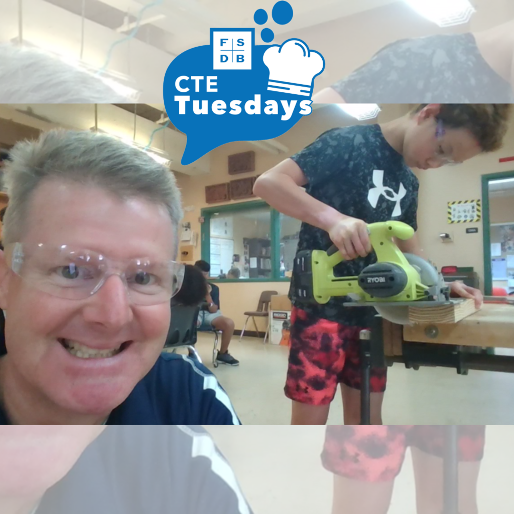A selfie of the woodshed teacher with a student working on a project with wood. 