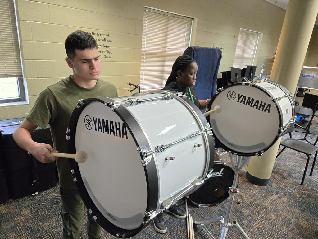 Facundo and Shanteria practice on the bass drums during Blind Cadence Drumline practice.