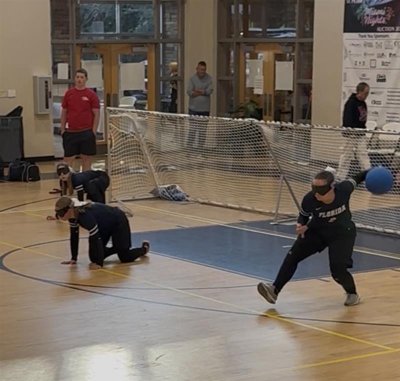 Aspen (right wing), Lily (center) and Jazmine (left wing) on the court. Jazmine is about to throw the ball.