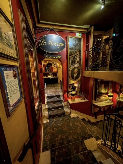 Inside a  restaurant named "Le Procope" which is the oldest car in Paris. 