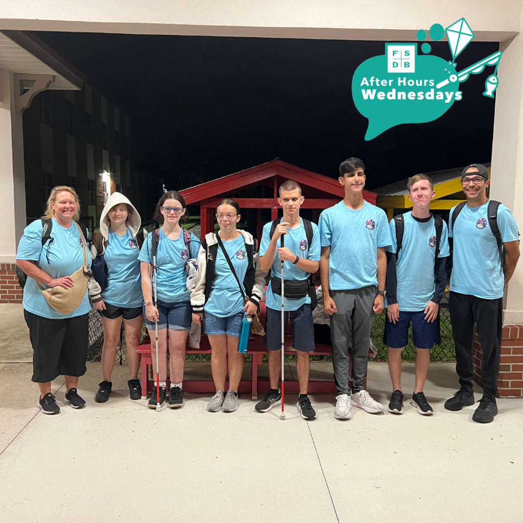 Group of six blind space camp students wearing matching blue shirts with two staff members smile for their photo at FSDB before their trip.
