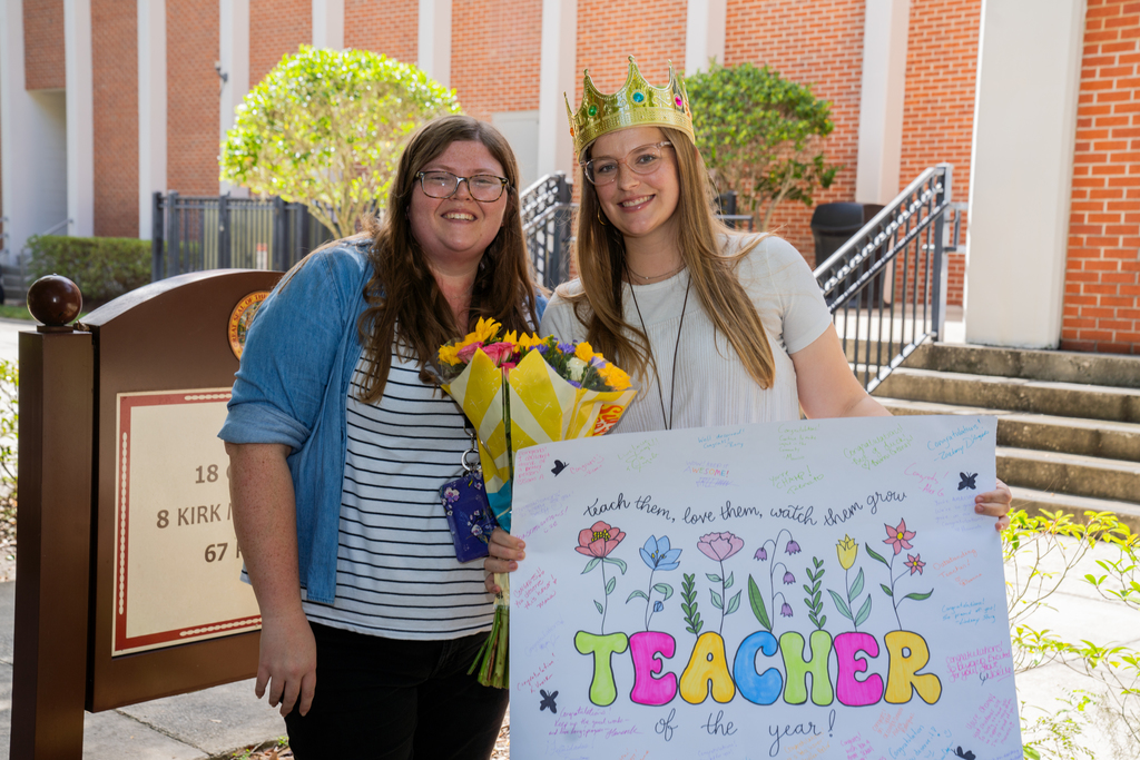 Last year TOY, Hannah, and Colleen smile for a photo together outside of Kirk.