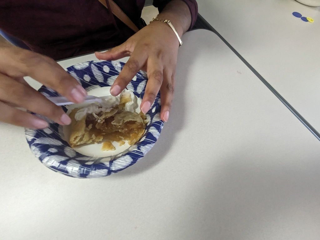 Up close picture of student's hands over their pie in the bowl.