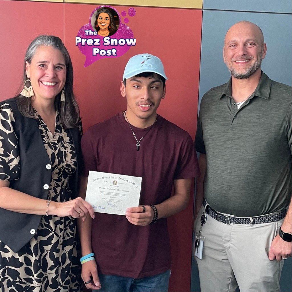 Left to Right: Tracie Snow, Michael, and Blind High School AP smile for a photo with Michael's diploma.