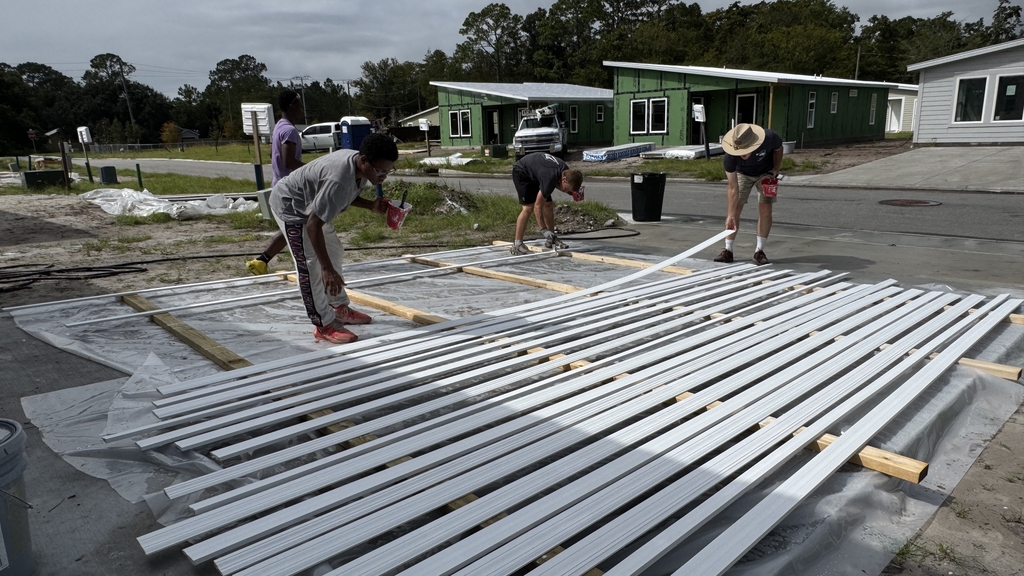 FSDB students working on construction outside in a St Augustine neighborhood.