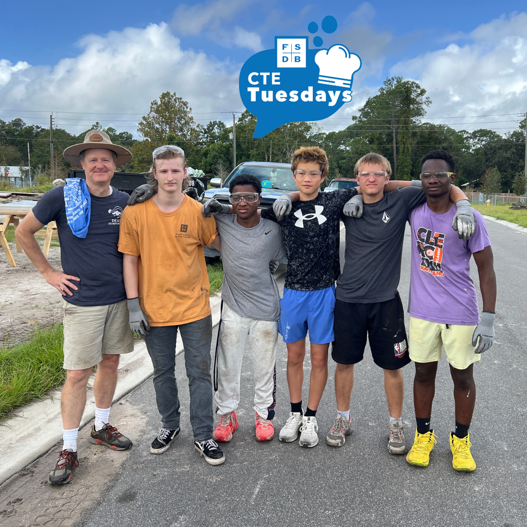 Group of FSDB students smiling with their teacher outside after a long day of hard work.