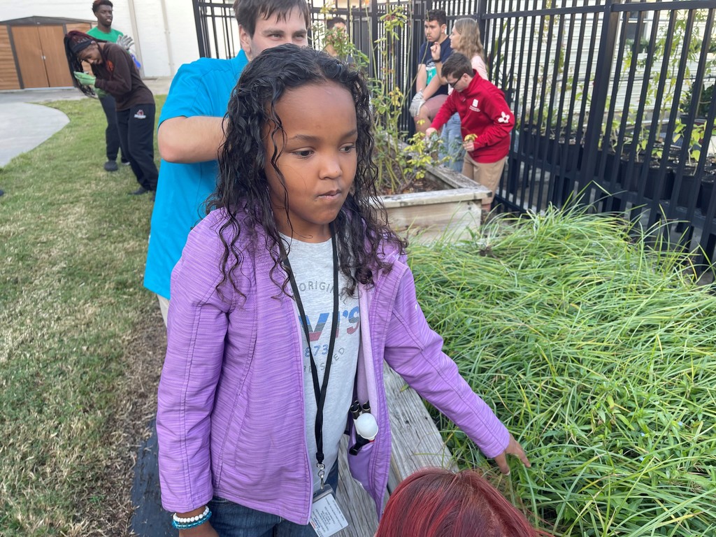 Mariah feels the plants while listening to Mr. Podlisney