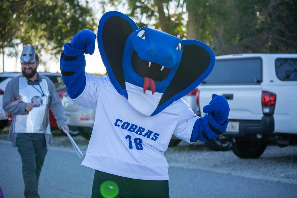 The cobra mascot pose for a photo in the middle of the street of FSDB. 