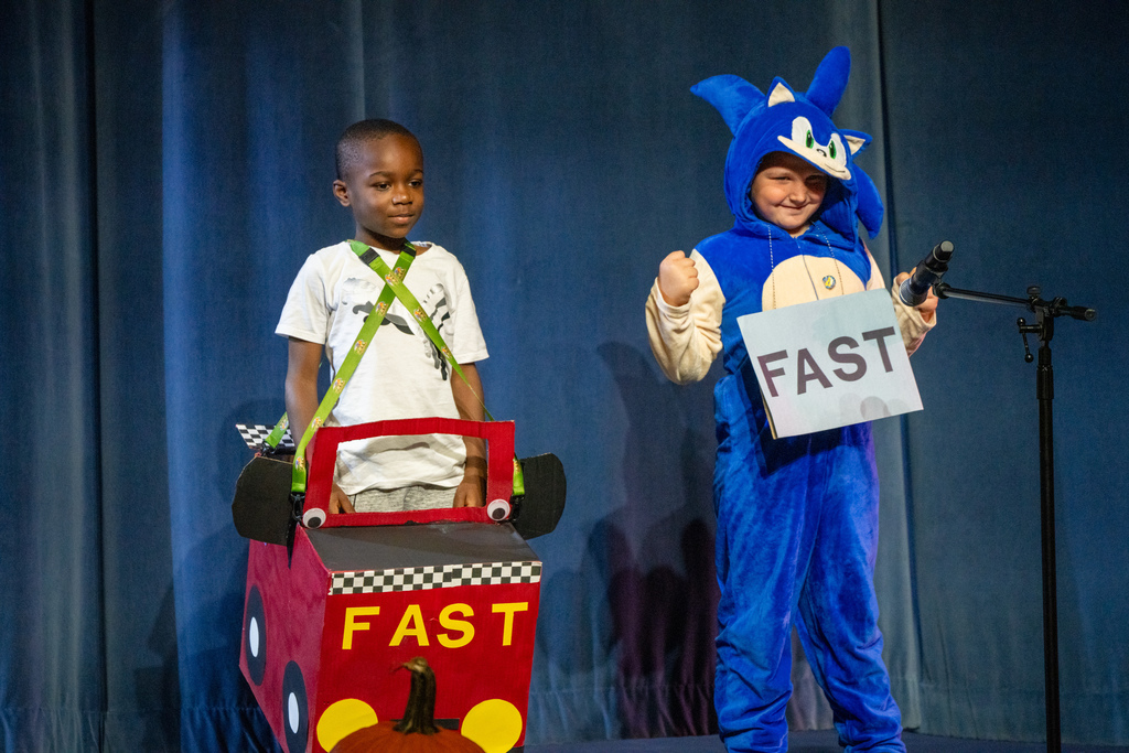 Two students dressed up as the word "fast". 