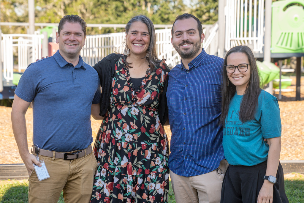 Ryan Johnson (blue polo and khaki pants), Tracie Snow, Zachary Bridgett and Jay Girton (black pants and a teal "Love Jacksonville Jaguars" shirt).  
