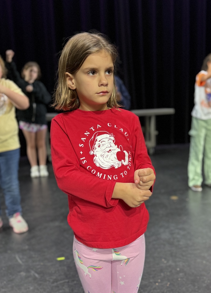 Students dancing on stage in Kirk.