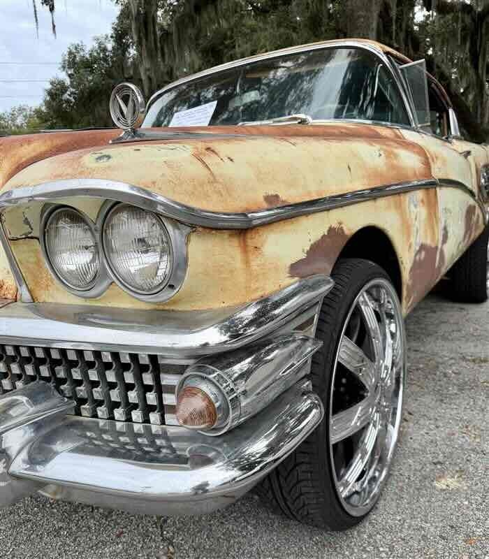 A close up vintage car parked on the FSDB campus in Palm Row.